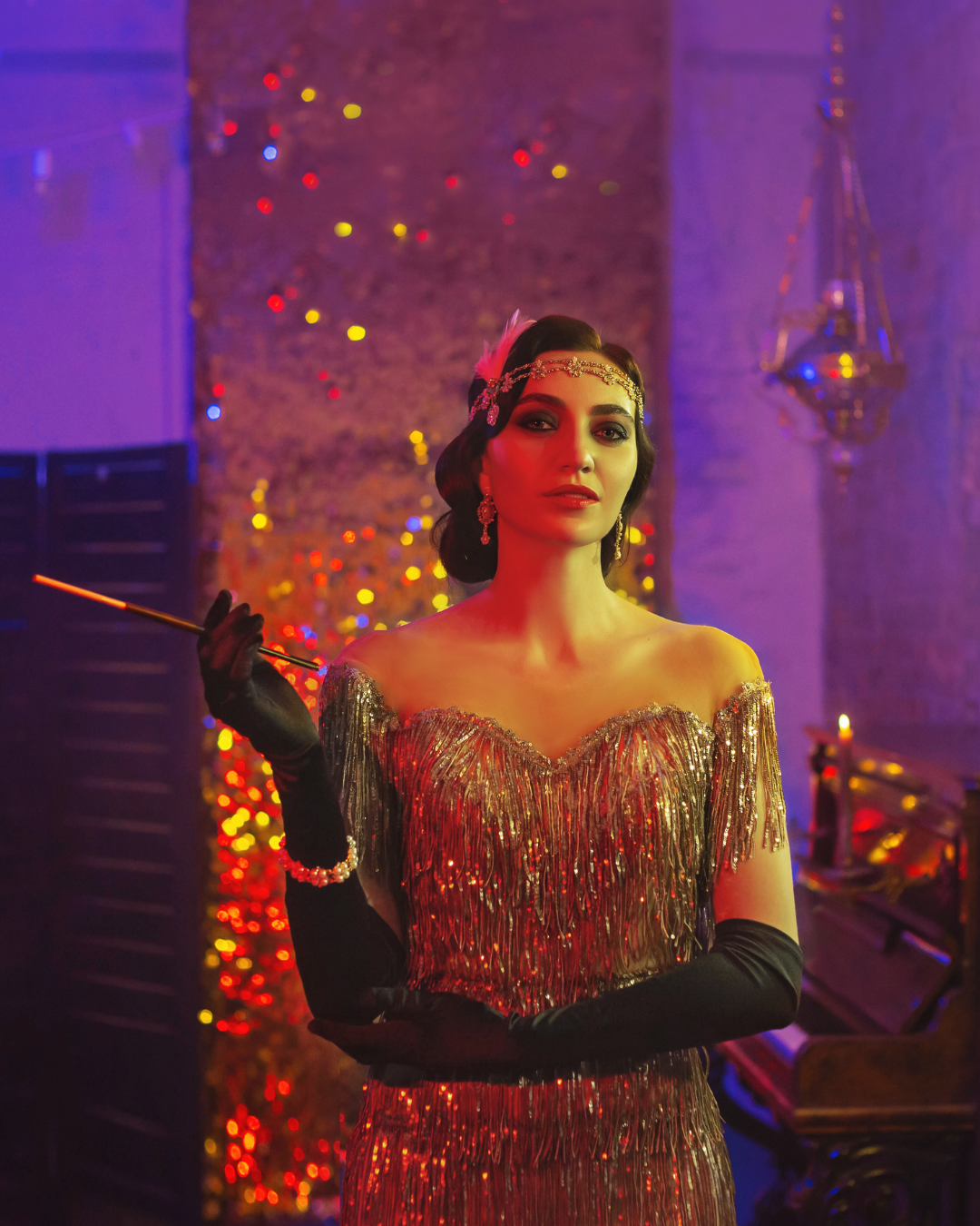 Woman in a glamorous outfit with a colorful, festive background